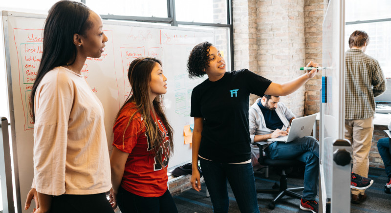 Coding Dojo instructor Vanessa Burroughs and students