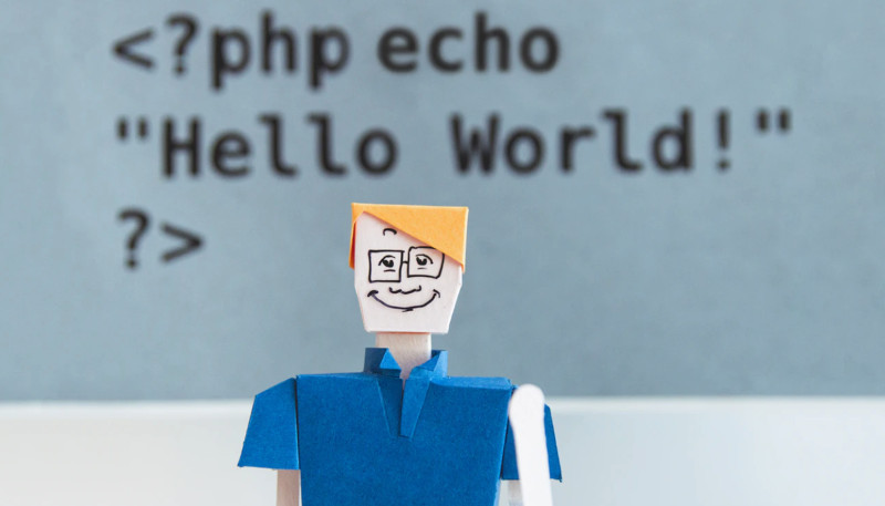 Paper guy in front of code