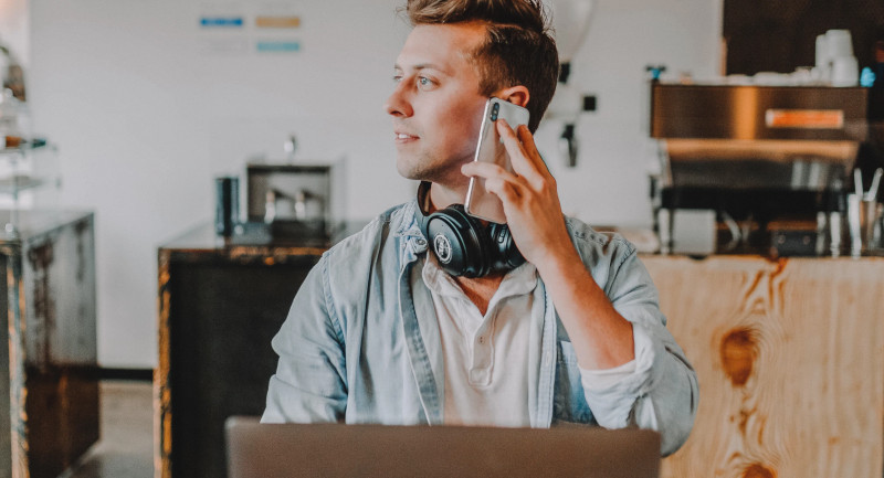 Man at laptop wearing headphones