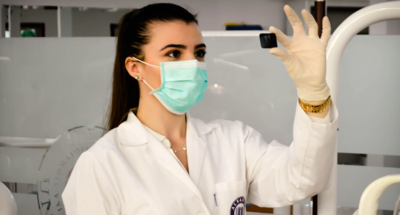 Doctor in a lab examining something