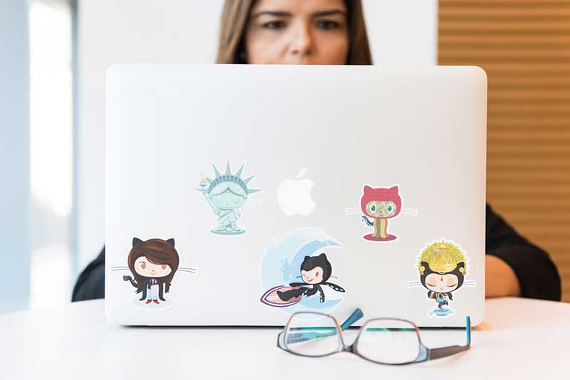 Women on laptop using GitHub
