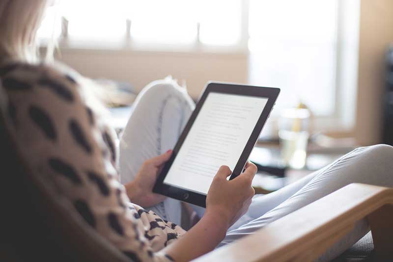 Woman reading on a tablet