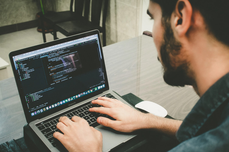 Man working on computer code