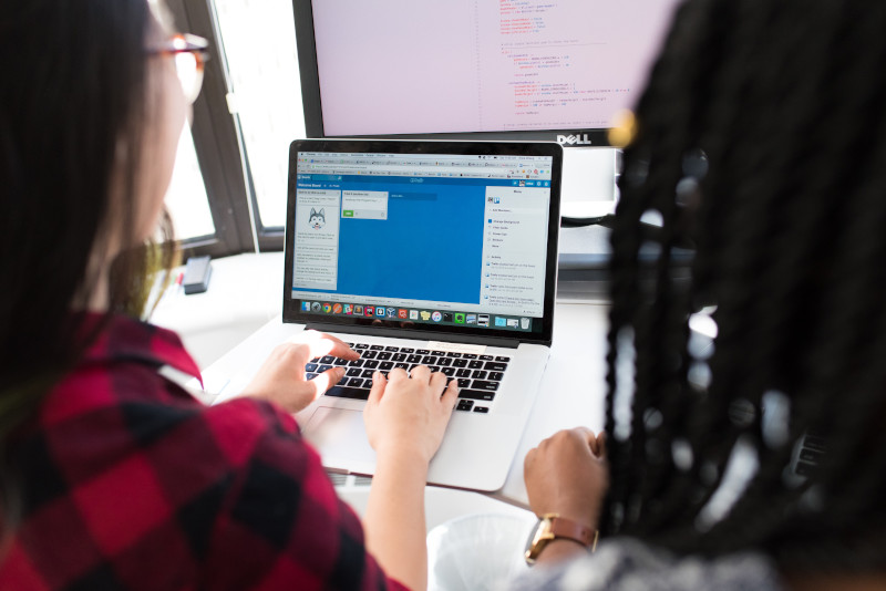 Two software developers working on Trello