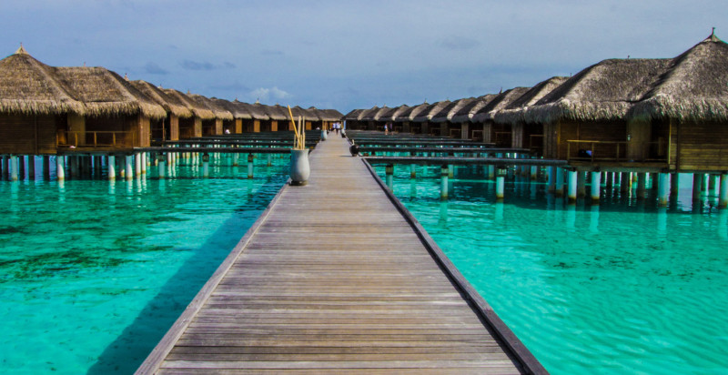 Huts over water in tropical location